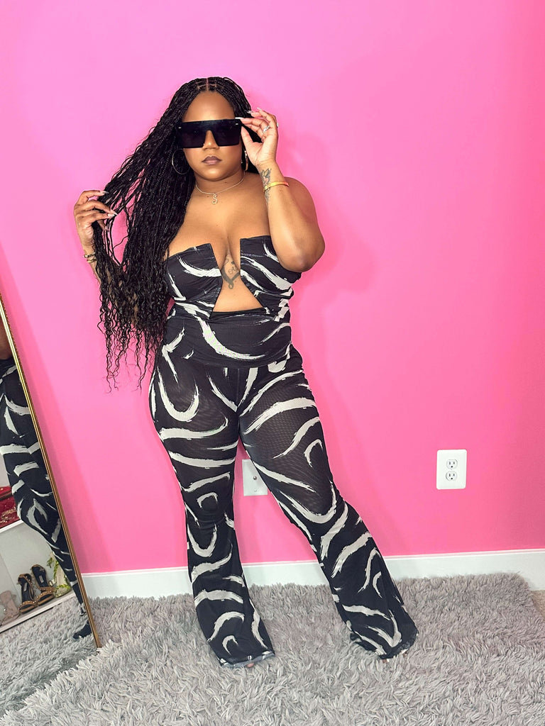 Black and white jumpsuit with boning in breast area 